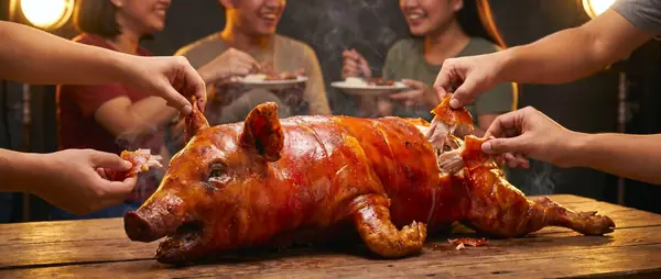Filipino feast sharing cebu lechon