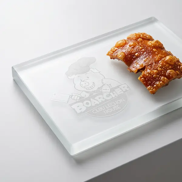 Lechon skin on glass slab