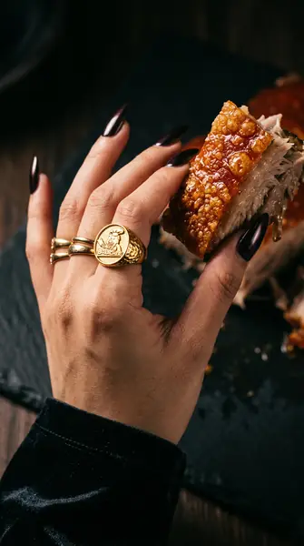 Model holding lechon with ring 2